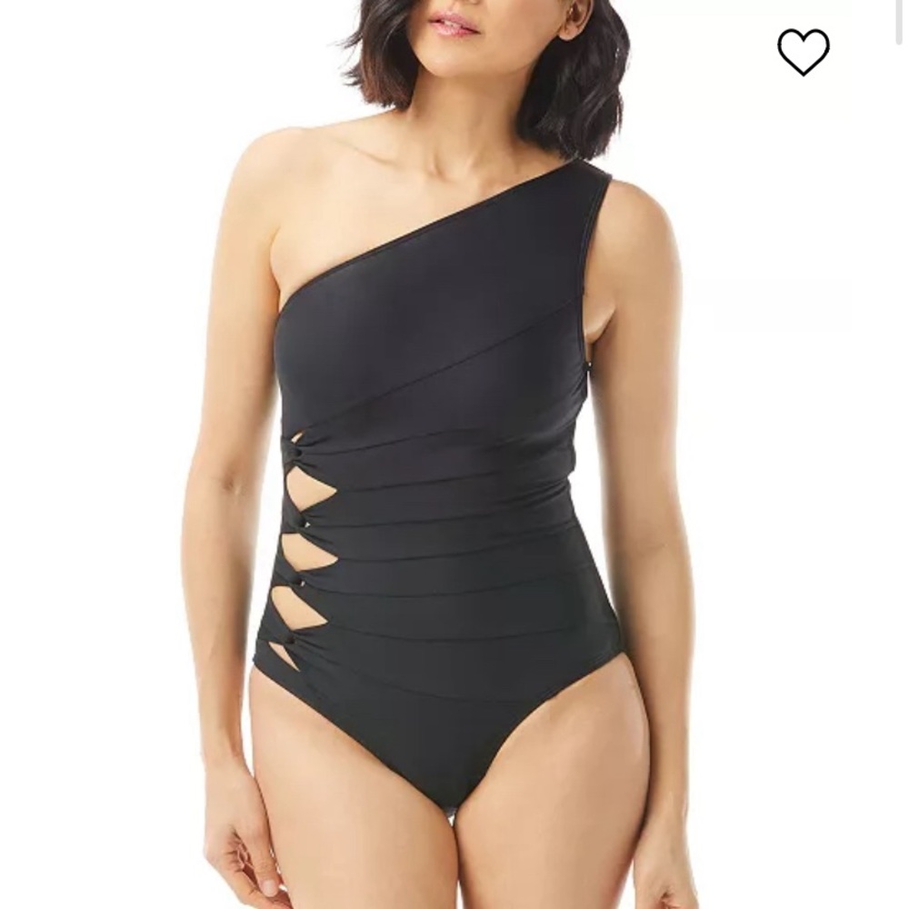 Swim Suit one piece with cut outs.